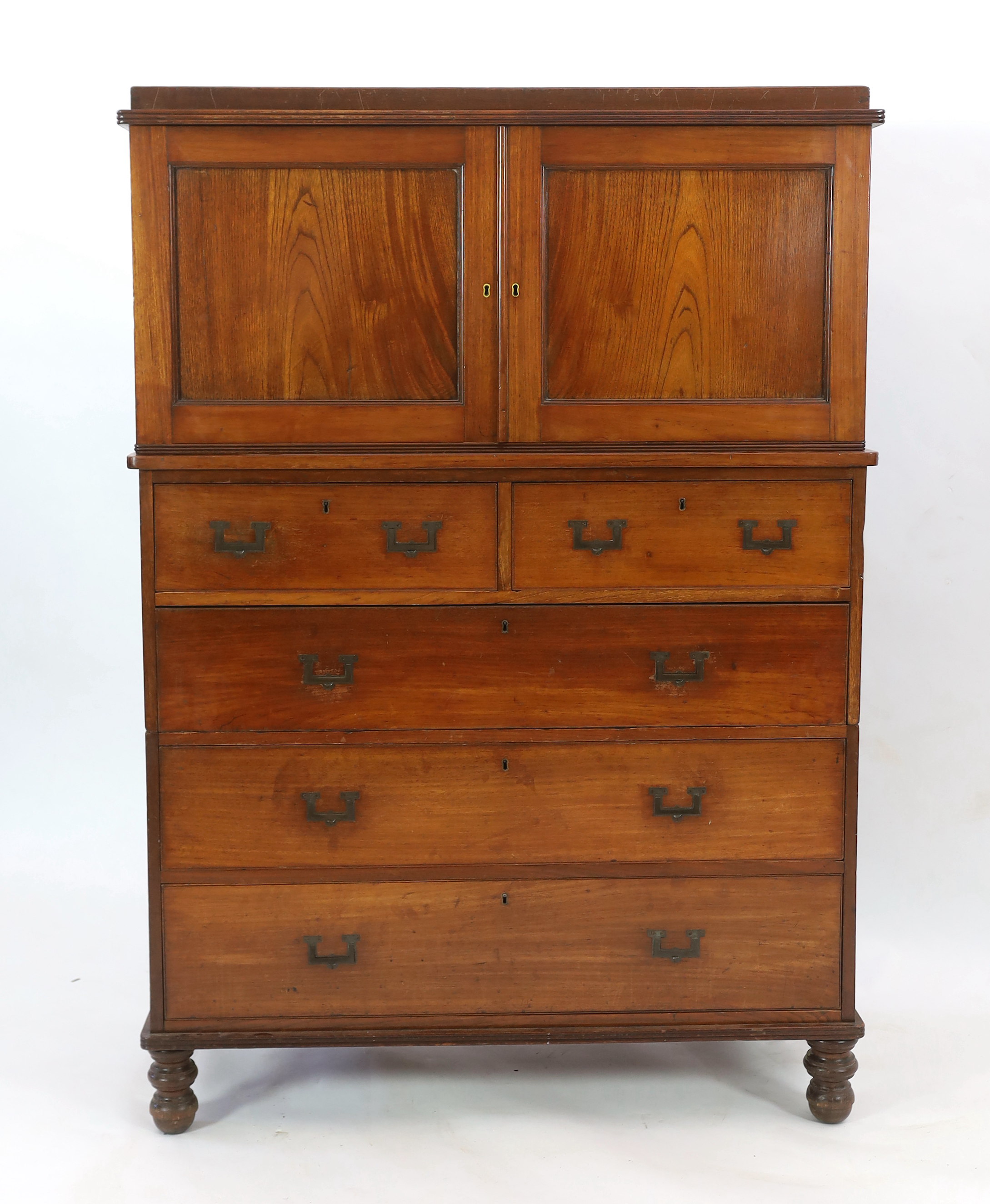 A Victorian teak campaign chest with press cupboard